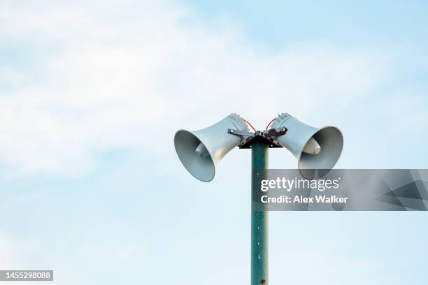 public address megaphone speakers against sky - alertness stock pictures, royalty-free photos & images