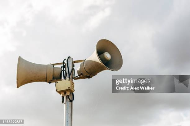 public address megaphone speakers against sky - alertness stock pictures, royalty-free photos & images