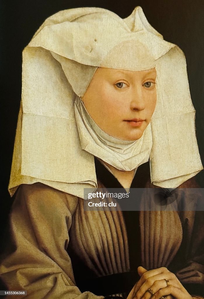 Portrait of a young woman with a white wide spreading hood