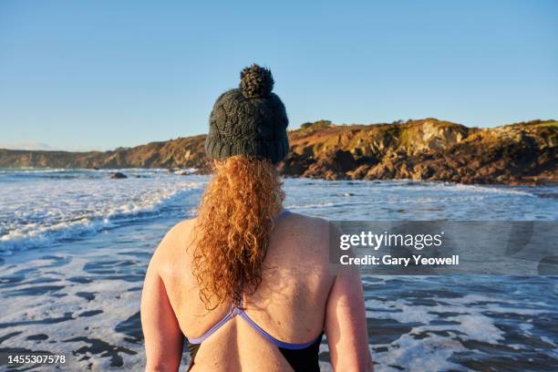winter swimming in the sea at sunrise - cold stock pictures, royalty-free photos & images