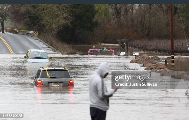 Cars are submerged in floodwater after heavy rain moved through the area on January 09, 2023 in Windsor, California. The San Francisco Bay Area...