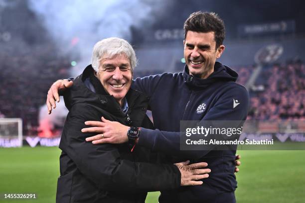 Gian Piero Gasperini, Head Coach of Atalanta BC, left, and Thiago Motta, Head Coach of Bologna FC, interact prior to the Serie A match between...