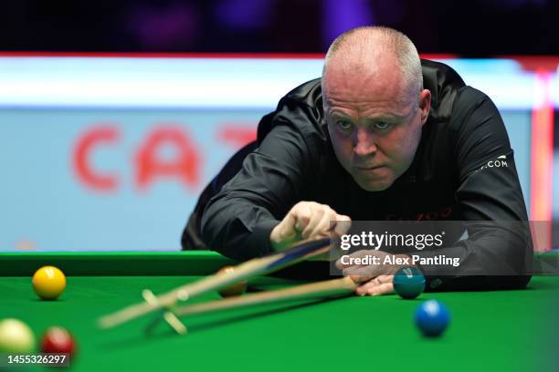 John Higgins of Scotland plays a shot during their first round match against Jack Lisowski of England at Alexandra Palace on January 09, 2023 in...