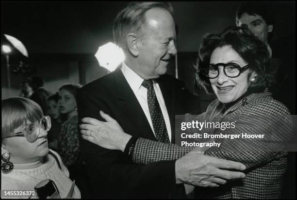 View of former US Senator Brock Adams and one of his former staffers Linda Burnett-Pomarantz as they embrace on election night at the Sheraton Hotel,...