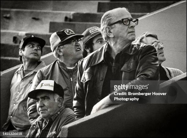 View of a spectators, most of whom look over their shoulders during a San Jose State University's baseball team practice, San Jose, California, 1980.