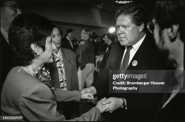 Newly-elected Insurance Commissioner Deborah Senn holds hands and talks with US representative Norm Dicks on election night at the Sheraton Hotel,...