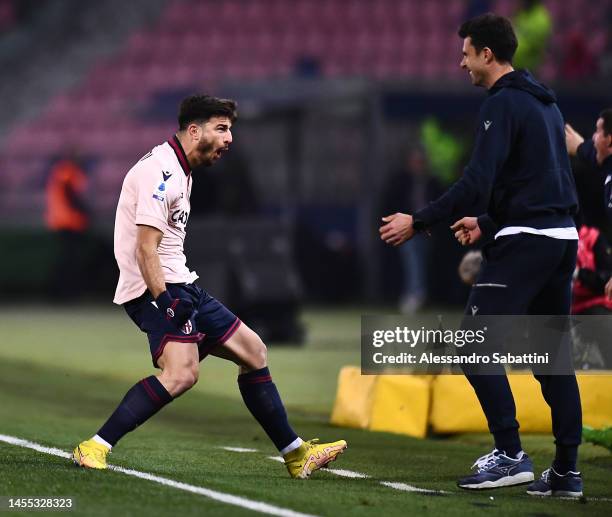 Riccardo Orsolini of Bologna FC celebrates with Thiago Motta, Head Coach of Bologna FC after scoring the team's first goal during the Serie A match...