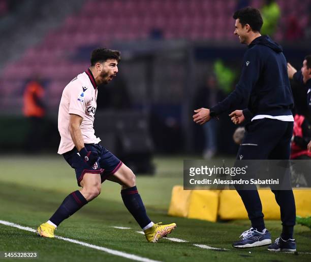 Riccardo Orsolini of Bologna FC celebrates with Thiago Motta, Head Coach of Bologna FC after scoring the team's first goal during the Serie A match...