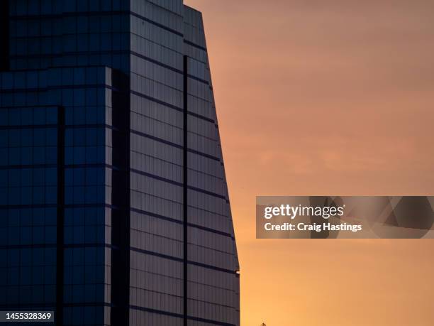 sunset office or residential apartment block - close up of macro high end office block business hq with copy space. - sunset society stock-fotos und bilder