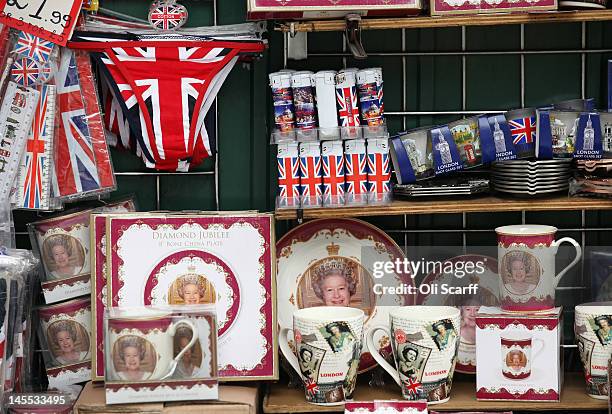 Memorabilia celebrating the Diamond Jubilee of Her Majesty Queen Elizabeth II on sale in Trafalgar Square on June 1, 2012 in London, England. With...