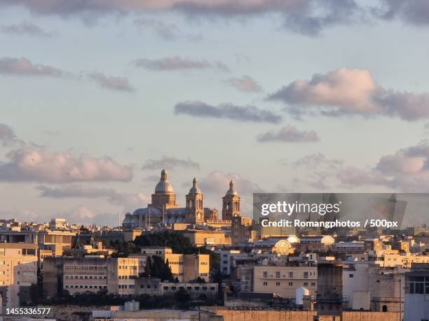 view of cityscape against cloudy sky,valletta,malta - modern malta stock pictures, royalty-free photos & images
