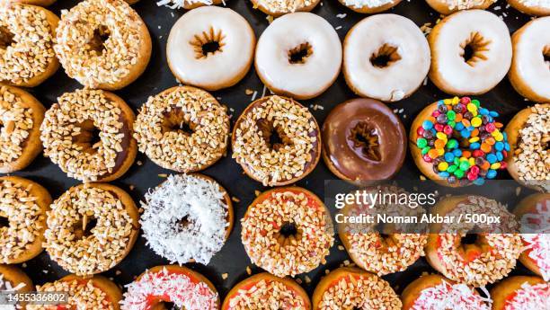 colorful doughnuts with sprinkles and topping,pakistan - donut fotografías e imágenes de stock