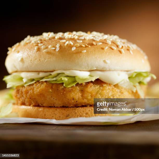 close-up of burger on serving board,pakistan - bun bread stock pictures, royalty-free photos & images
