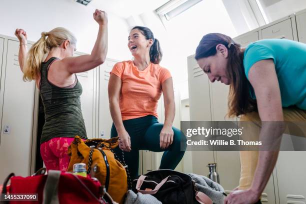 women in gym locker room - womens locker room stock pictures, royalty-free photos & images