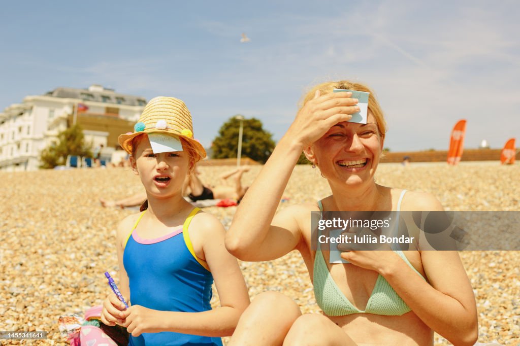 Mother and daughter playing guess game