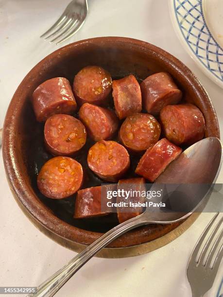 roast sausage on a bowl - chorizo stock pictures, royalty-free photos & images