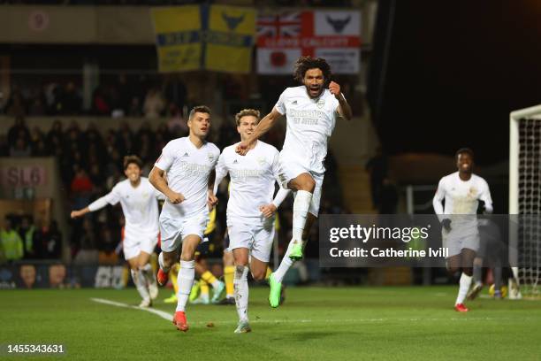 Mohamed Elneny of Arsenal celebrates with teammates Granit Xhaka and Rob Holding of Arsenal after scoring the team's first goal during the Emirates...