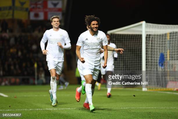 Mohamed Elneny of Arsenal celebrates with teammate Rob Holding of Arsenal after scoring the team's first goal during the Emirates FA Cup Third Round...