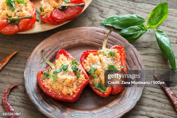 stuffed red bell peppers with white rice and cheese,romania - red pepper stock pictures, royalty-free photos & images