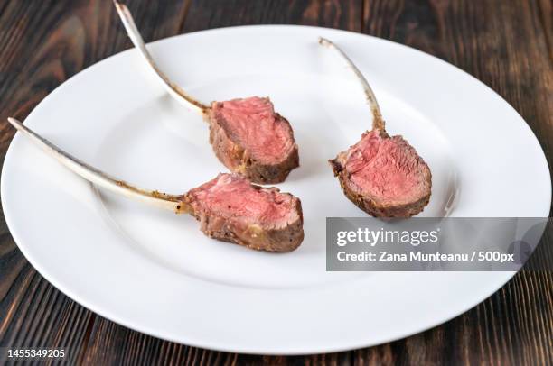 close-up of meat in plate on table,romania - lamb chop stock pictures, royalty-free photos & images