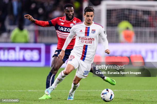 Romain Faivre of Lyon dribbles Jonathan Bamba of Lille during the Ligue 1 match between Olympique Lyonnais and LOSC Lille at Groupama Stadium on...