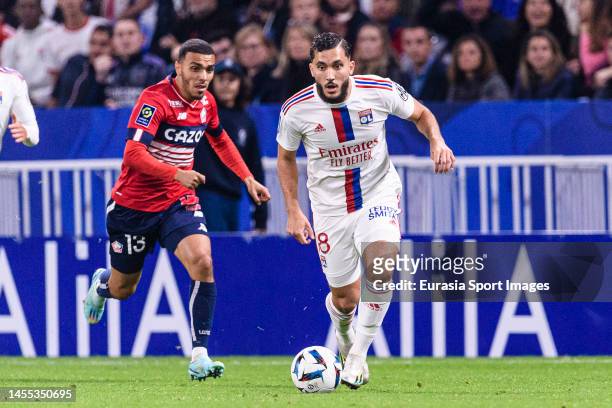 Rayan Cherki of Lyon controls the ball during the Ligue 1 match between Olympique Lyonnais and LOSC Lille at Groupama Stadium on October 30, 2022 in...
