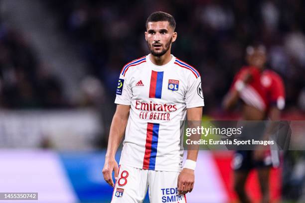 Houssem Aouar of Lyon walks in the field during the Ligue 1 match between Olympique Lyonnais and LOSC Lille at Groupama Stadium on October 30, 2022...