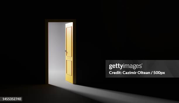 empty illuminated room in darkroom,romania - open romania stock pictures, royalty-free photos & images