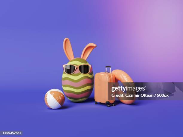 close-up of easter eggs against yellow background,romania - suitcase close stock-fotos und bilder