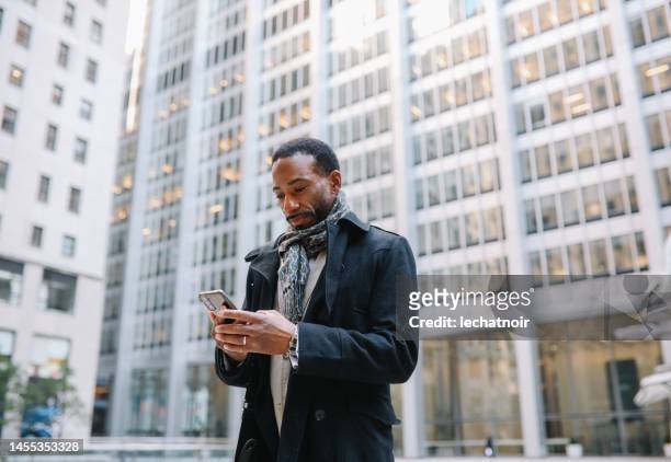 businessman in lower manhattan - black wealth stock pictures, royalty-free photos & images