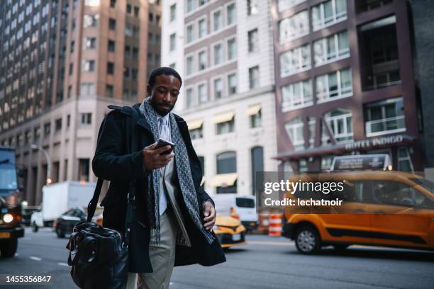 calling a cab in lower manhattan - new york taxi stock pictures, royalty-free photos & images