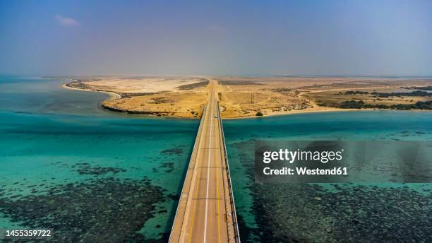 saudi arabia, jazan province, aerial view of bridge linking two islands in farasan islands archipelago - saudi bridge stock pictures, royalty-free photos & images