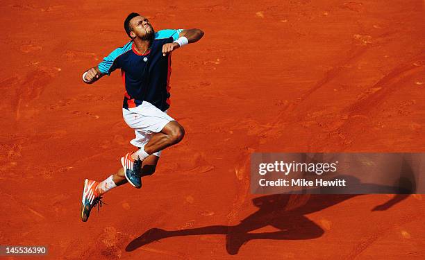 Jo-Wilfried Tsonga of France celebrates victory in his men's singles third round match against Fabio Fognini of Italy during day six of the French...