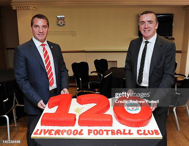 Brendan Rodgers the new LFC manager and Ian Ayre, managing director with a cake baked to celebrate the 120th Birthday of the club at Anfield on June...