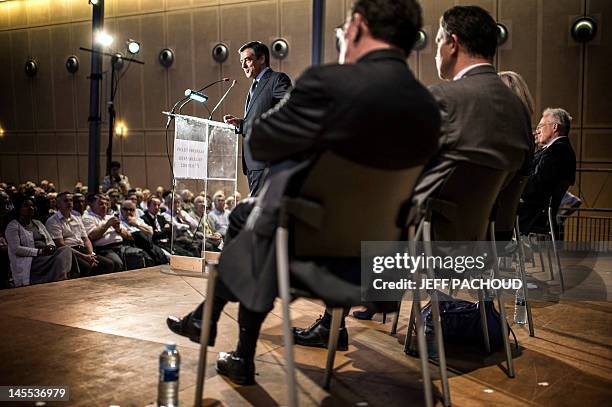 Former French Prime Minister Francois Fillon delivers a speech during a visit to support Union for a Popular Movement deputy and candidate for...