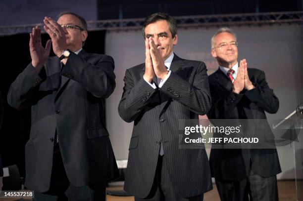 Former French Prime Minister Francois Fillon acknowledges the audience at the end of his speech during a visit to support Union for a Popular...