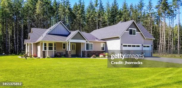 luxury single story home exterior surrounded by trees - bungalow stock pictures, royalty-free photos & images