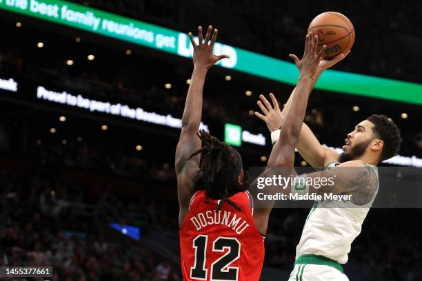 Jayson Tatum of the Boston Celtics takes a shot against Ayo Dosunmu of the Chicago Bulls during the first half at TD Garden on January 09, 2023 in...