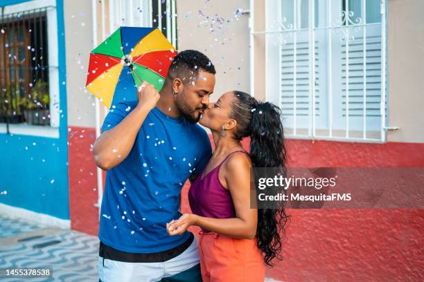 kiss on the lips at brazilian carnival - kissing mouth stock pictures, royalty-free photos & images
