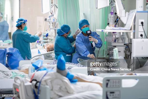 Medical workers treat patients with severe COVID-induced conditions at Shanxi Bethune Hospital on January 9, 2023 in Taiyuan, Shanxi Province of...