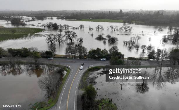 In an aerial view, floodwaters fill fields on January 09, 2023 in Santa Rosa, California. The San Francisco Bay Area and much of Northern California...