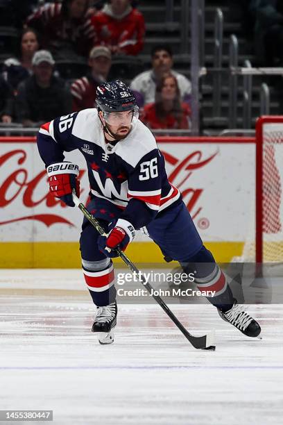 Erik Gustafsson of the Washington Capitals skates the puck up the ice during a game against the Columbus Blue Jackets at Capital One Arena on January...