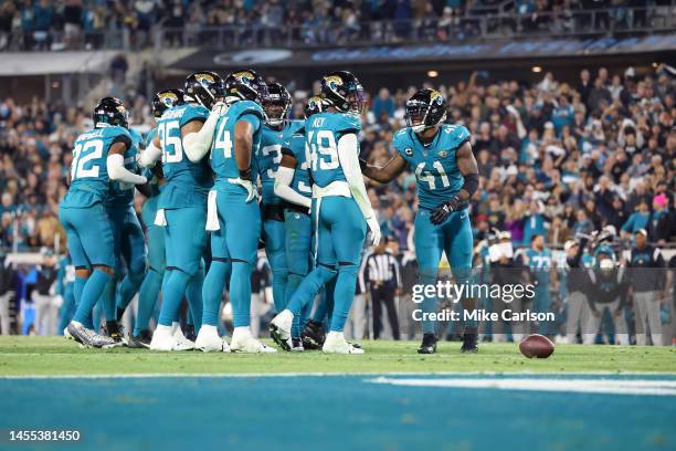 The defense of the Jacksonville Jaguars huddles against the Tennessee Titans at TIAA Bank Field on January 8, 2023 in Jacksonville, Florida.