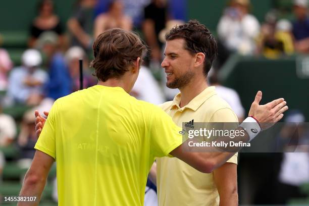 Alex de Minaur of Australia and Dominic Thiem of Austria react after the match during day one of the 2023 Kooyong Classic at Kooyong on January 10,...