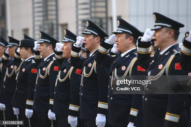 Police officers attend a police flag raising ceremony to mark the 3rd Chinese People's Police Day on January 9, 2023 in Jinan, Shandong Province of...