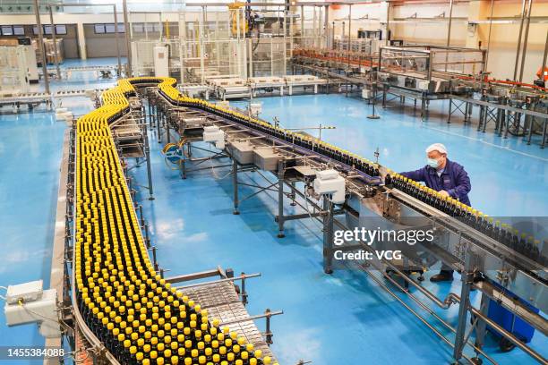 Worker checks bottled soy sauce at a factory of Hengshun Group on January 9, 2023 in Zhenjiang, Jiangsu Province of China.