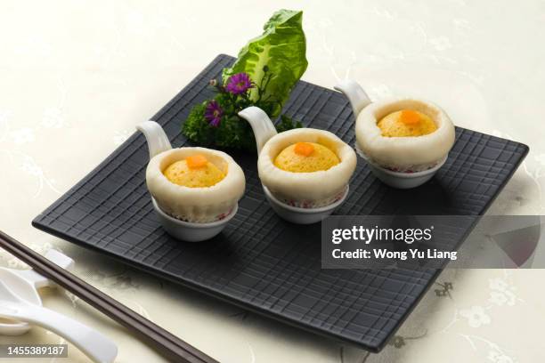 chinese dim sum on table - square plate stock pictures, royalty-free photos & images