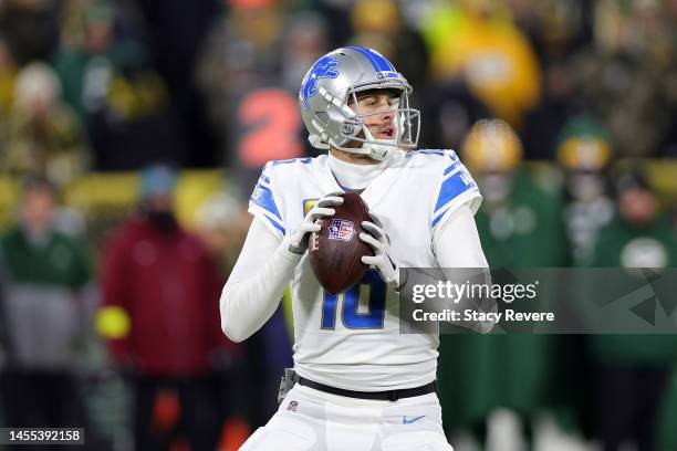 Jared Goff of the Detroit Lions drops back to pass during a game against the Green Bay Packers at Lambeau Field on January 08, 2023 in Green Bay,...