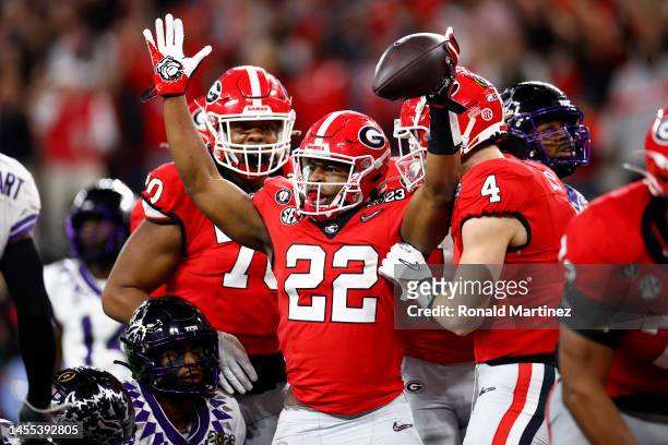 Branson Robinson of the Georgia Bulldogs celebrates a touchdown in the fourth quarter with teammates against the TCU Horned Frogs in the College...
