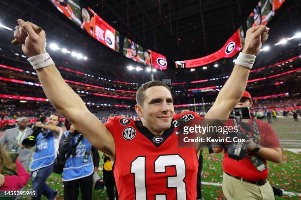 Stetson Bennett of the Georgia Bulldogs celebrates after defeating the TCU Horned Frogs in the College Football Playoff National Championship game at...